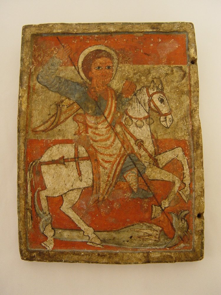 Saint George slaying a dragon painted on carved wood, 17th century