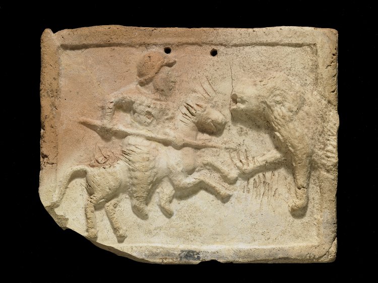 Plaque showing a heavily armoured horseman (cataphract) spearing a lion, 3rd century BC - 2nd century, Parthian or Seleucid