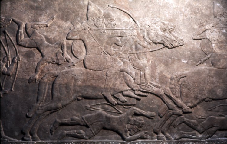 Gypsum wall panel relief showing Assyrian cavalry and infantry attacking the enemy, 865 BC-860 BC, Neo-Assyrian (Iraq)