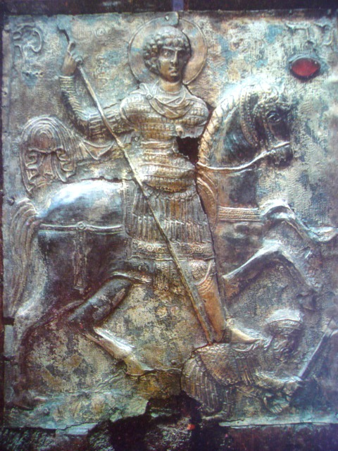 St. George spearing a fallen warrior, possibly the emperor Diocletian, his prosecutor, 11th century